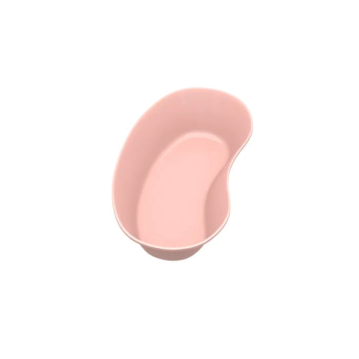 A light pink kidney dish sits on a white background.