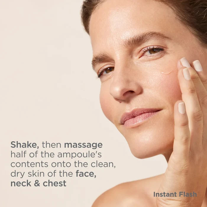 Woman applying ISDIN Instant Flash ampoule serum to face, neck and chest