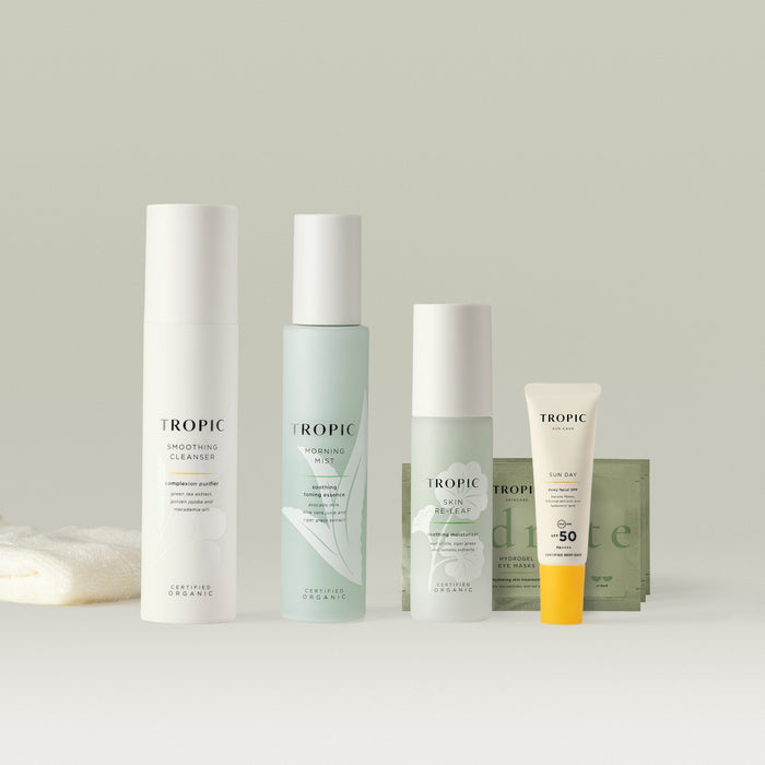 A Tropic skincare set featuring cleanser, mist, moisturiser, eye masks, and SPF.