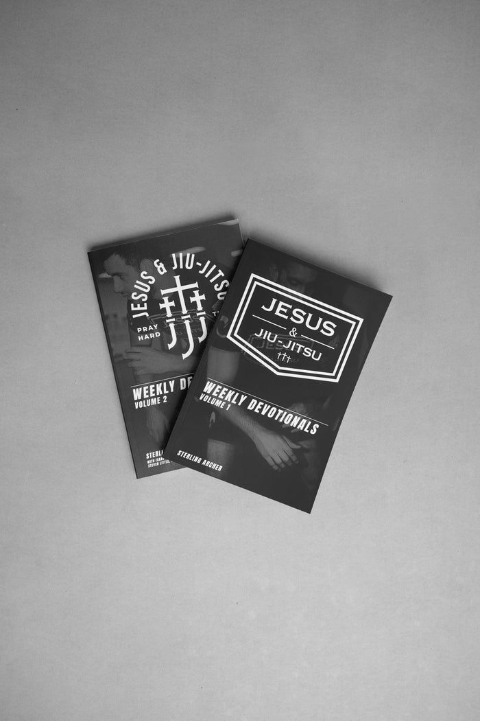 Two black Devotional books with white text on a gray background