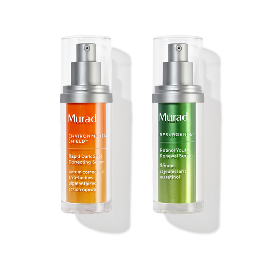 Two Murad skincare pump bottles on a white background, one with an orange label and one with a green label, both in clear cylindrical packaging with silver pumps.