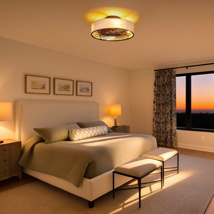 Cozy bedroom with a bed, nightstands, and a window showing a sunset.