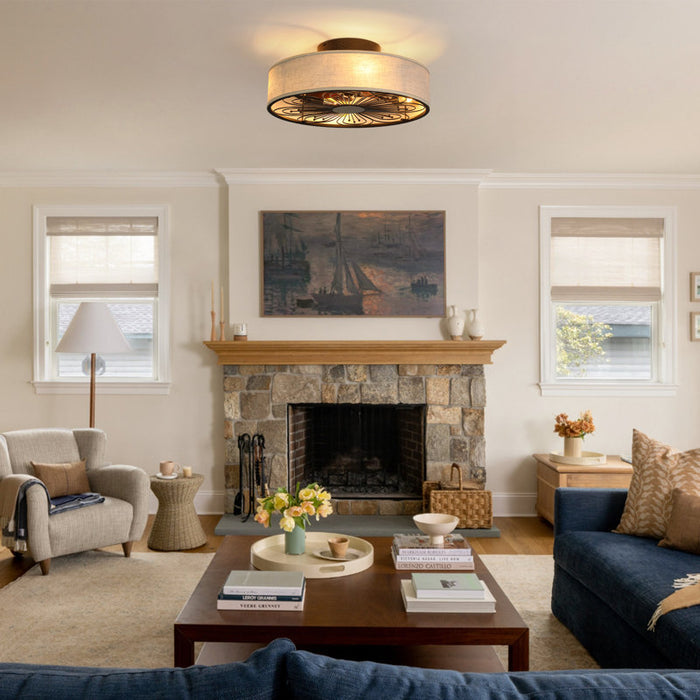 Living room with stone fireplace, comfortable furniture, and decorative elements.