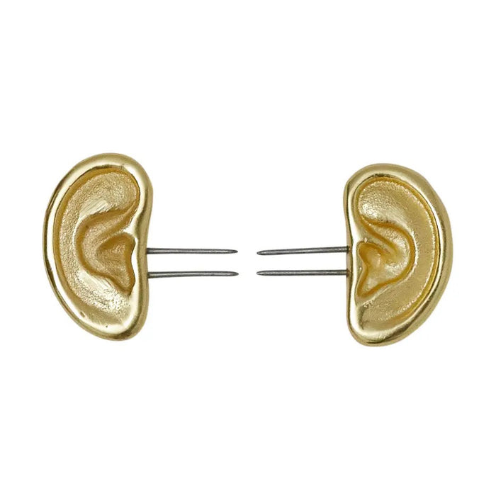 BE HOME - GOLD EAR CORN HOLDERS by BE HOME, INC: Handcrafted, gold-colored ear-shaped corn holders with two stainless steel prongs, showcased on a white background.
