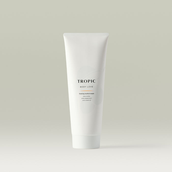 White Tropic tube labelled “Body Love,” a firming buttercream with shea butter, pink peppercorn, and vitamin E, displayed on a neutral background.