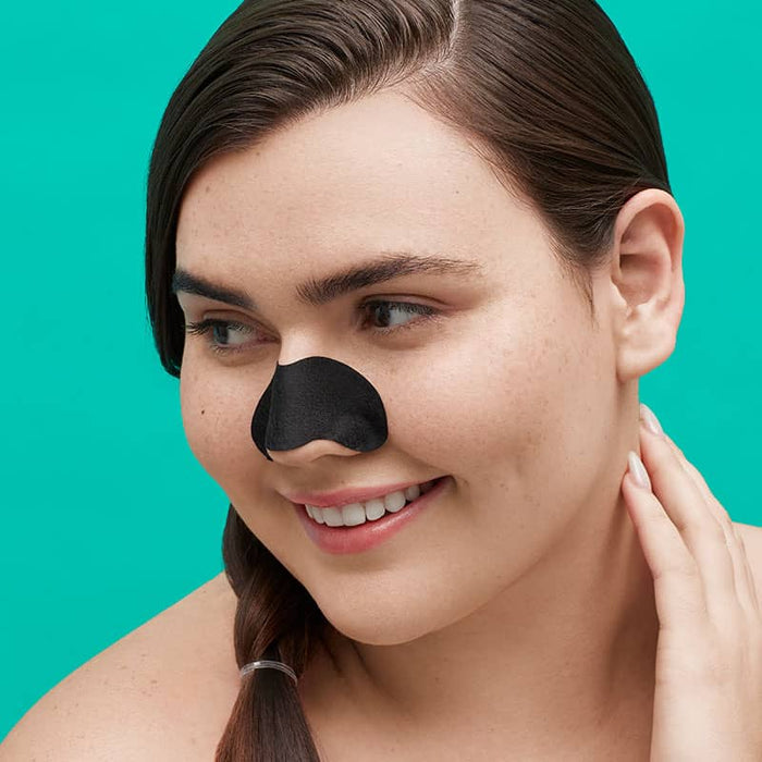 Charcoal unclog pores blackheads on woman's nose