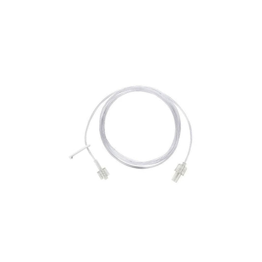 A clear plastic tube, coiled, with connectors at each end, sits on a white background.