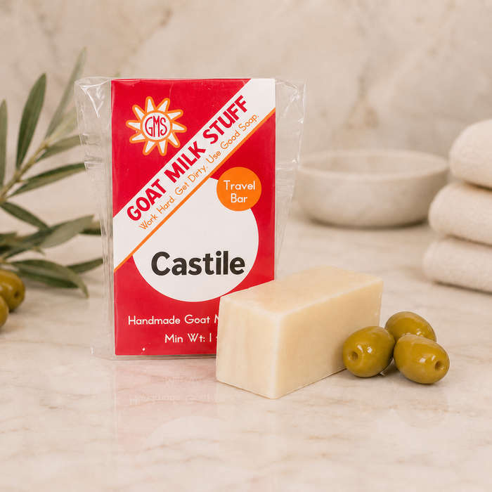 Goat Milk Stuff Castile soap bar with packaging on a neutral background