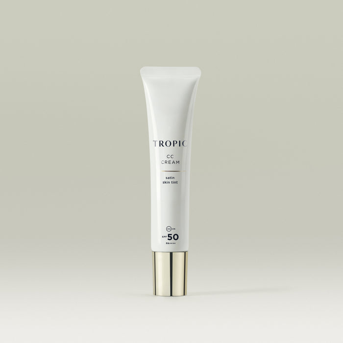Tropic CC Cream Satin Skin Tint in a sleek white tube with a metallic cap, featuring SPF 50 protection.