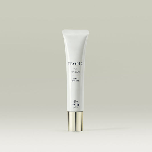 Tropic CC Cream Satin Skin Tint in a sleek white tube with a metallic cap, featuring SPF 50 protection.
