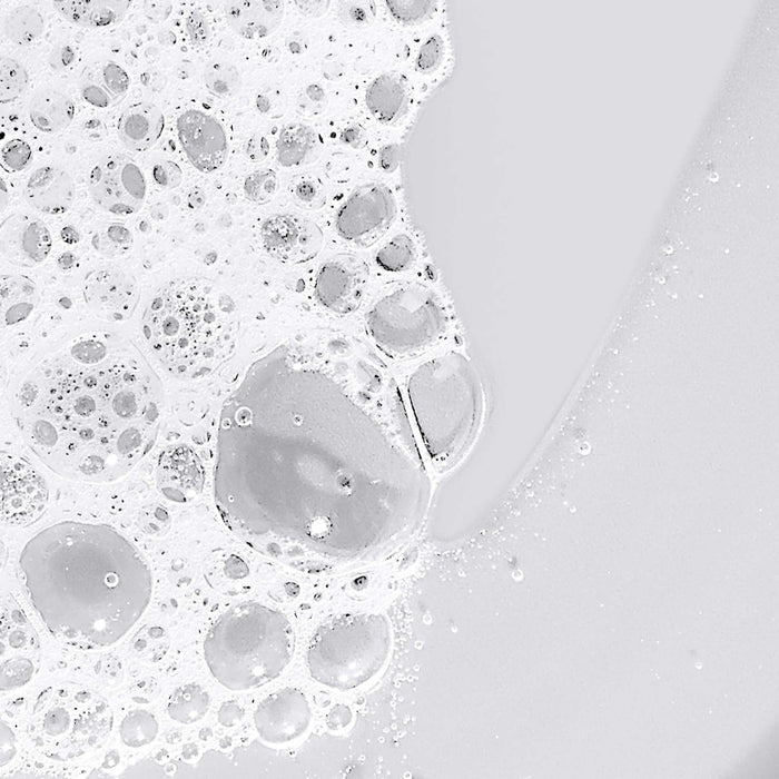 Close-up of soap bubbles on a white surface