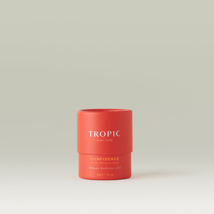 Tropic Confidence Skincare Deodorant Refill, Blood Orange & Cedar, 40g - matte coral-red cylindrical pot on a neutral background.