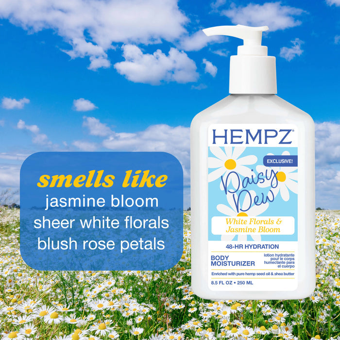 Hempz Daisy Dew body moisturizer bottle with a field of daisies and blue sky in the background