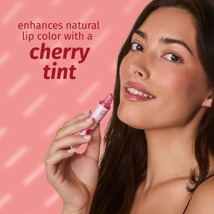 Woman holding a pink lip product with text on a pink background
