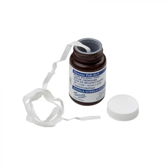 A sterile packing strip emerges from a brown bottle; it is labeled "Derma Pak-its," "PLAIN PACKING STRIP," "MÈCHE ORDINAIRE," "GASA DE RELLENO SIMPLE," "1 ¼ x 5 yds / 6.1 cm x 4.5 m," and "STERILE/STÉRILE/ESTÉRILE." The bottle's cap is open on a white background.