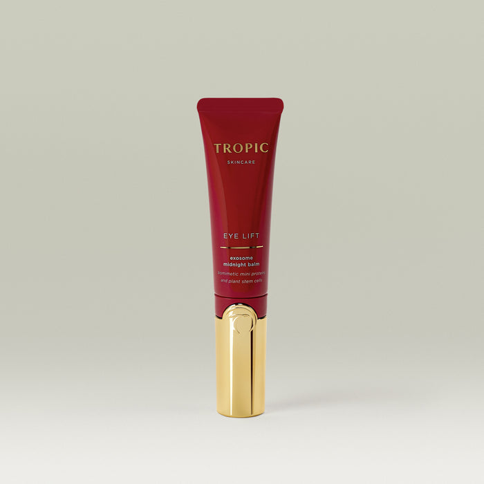 Tropic Skincare Eye Lift Exosome Midnight Balm in a sleek red and gold