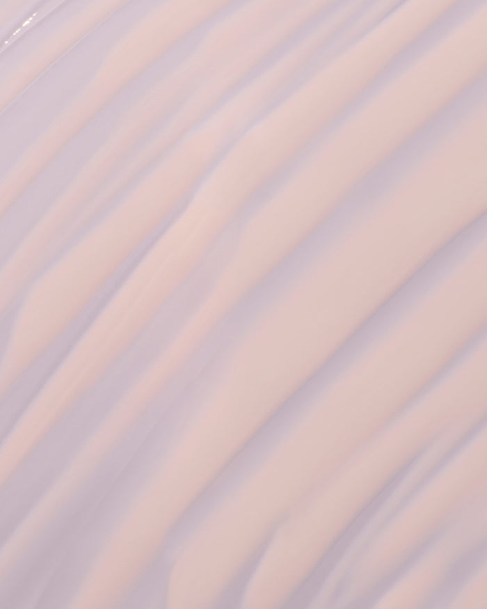 fat water milky smear on a lilac background