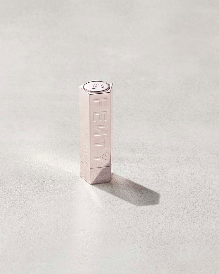 A Fenty Icon metallic refillable lipstick case.