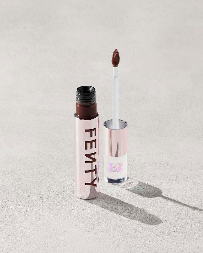 An open Fenty Icon Velvet lipstick tube on a light background.