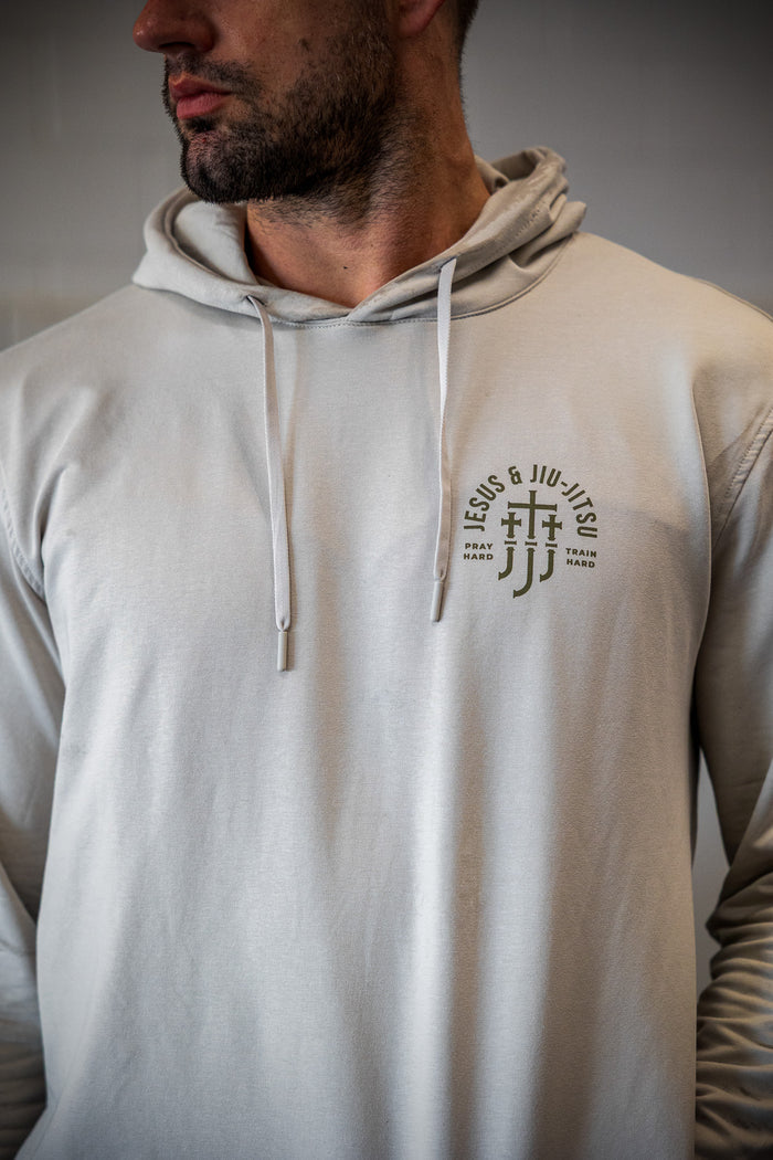 Man in smoke hoodie with JJJ logo on left chest