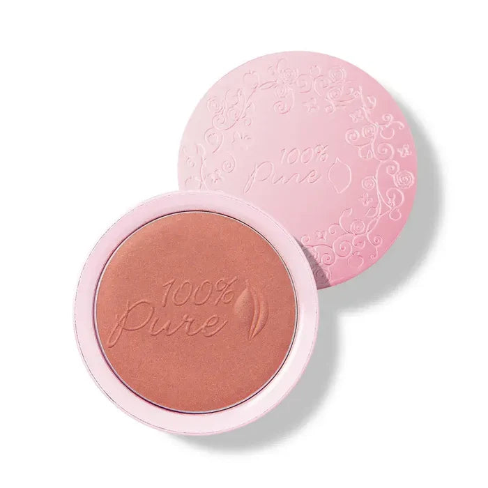 100% Pure blush in a pink compact on a white background