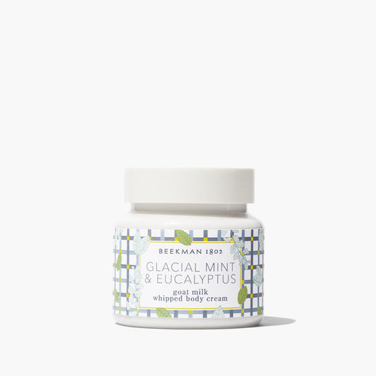 Jar of Beekman 1802's Glacial Mint & Eucalyptus Whipped Body Cream standing on a white background.