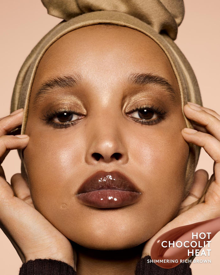 Close-up of model wearing shimmering rich brown lip gloss