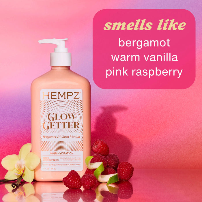 Hempz Glow Getter bottle with raspberries and flowers on a pink background describing scent notes