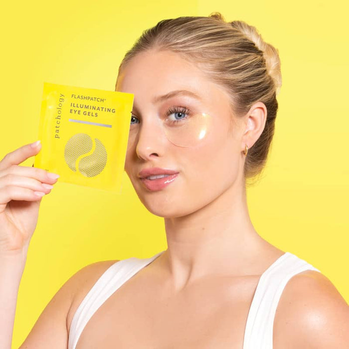 woman using illuminating undereye patches eye mask for dark circles