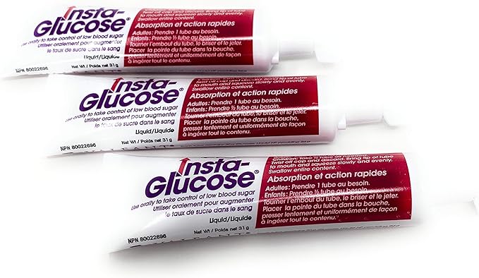Three tubes of Insta-Glucose gel lie slightly overlapping on a white background. The tubes are predominantly white with purple and red text and graphics.