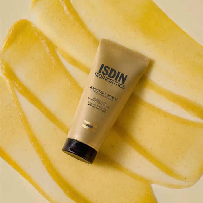 ISDIN Essential Scrub exfoliating cleanser tube with olive leaf on yellow scrub texture
