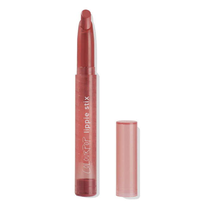 ColourPop Lippie Stix 'It's Giving' standing uncapped, revealing a rosy mauve twist-up bullet in a semi-transparent pink tube with white logo, the cap set beside it on a white studio background.