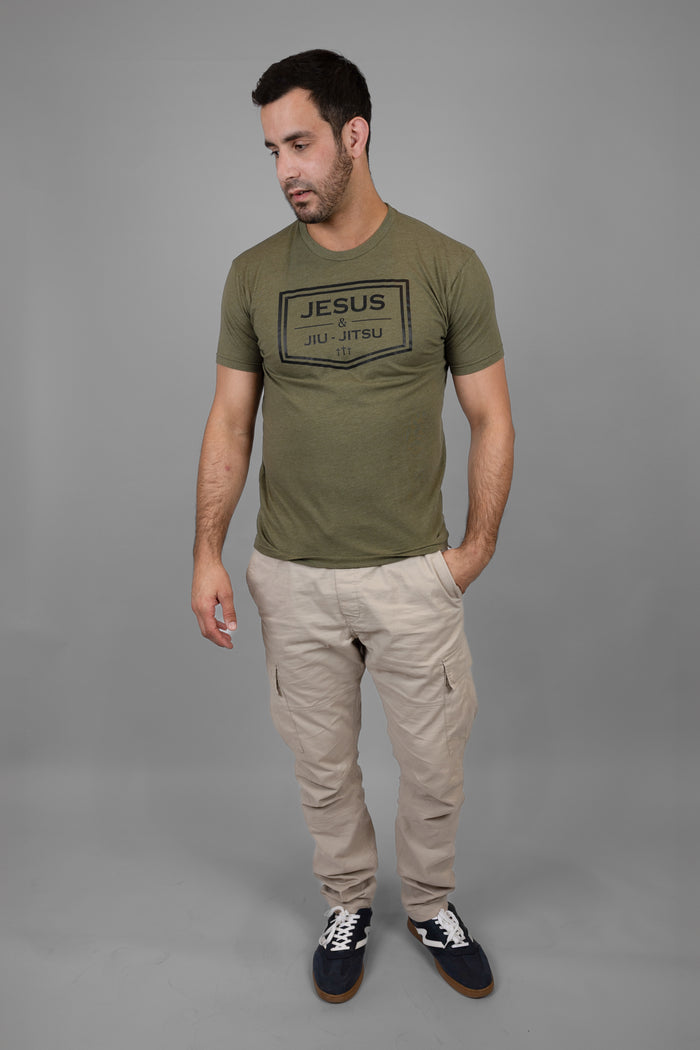Man wearing green tee with black JESUS & JIU-JITSU logo