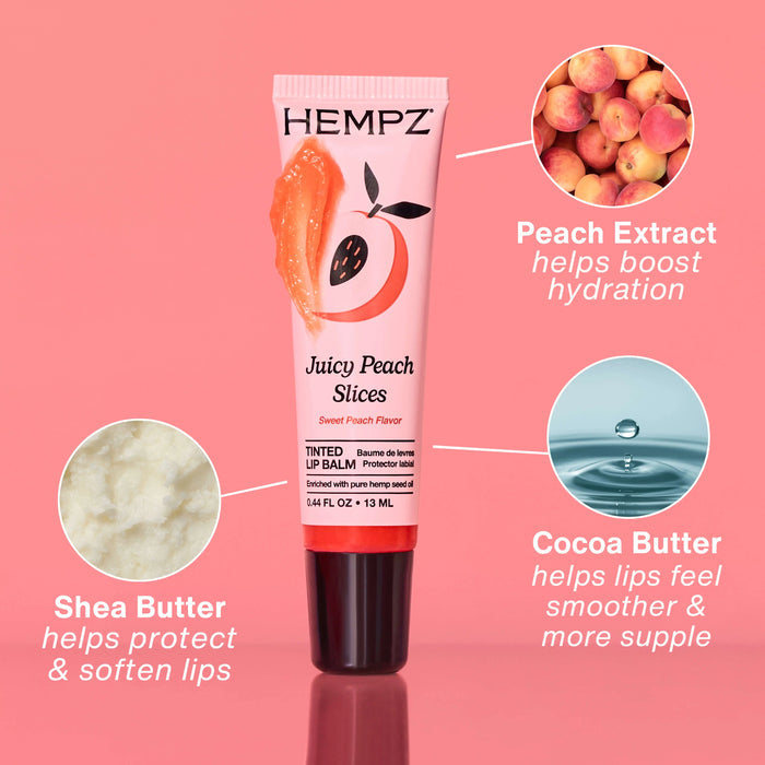 Hempz Juicy Peach Slices lip balm tube with peach extract and cocoa butter benefits on a pink background
