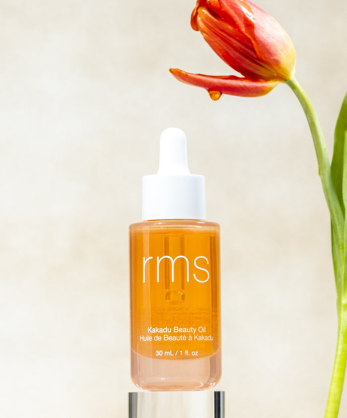 RMS Kakadu Beauty Oil in a clear bottle with a dropper