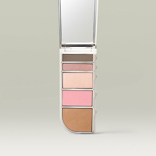 Tropic Colour Palette in the “Spring” shade, featuring five pressed powders in nude, pink, and brown tones arranged vertically with a built-in mirror.