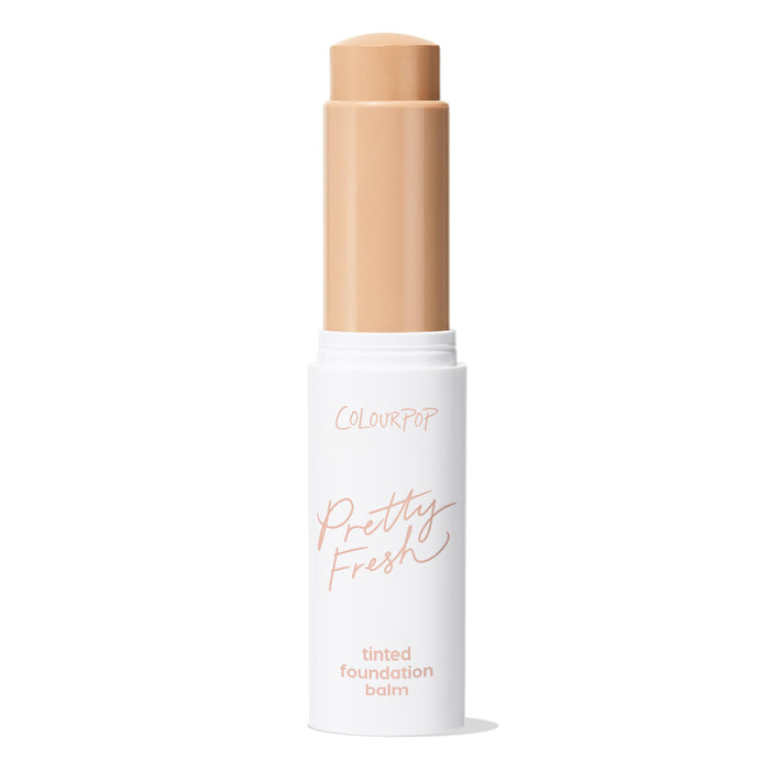 ColourPop Pretty Fresh Tinted Foundation Balm in Light 7 shown open, the beige balm extended from a twist-up stick; sleek white tube with peach Pretty Fresh branding, photographed on a clean white background.