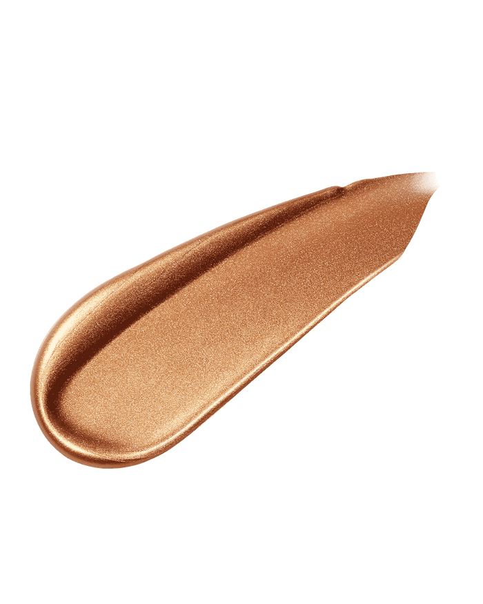 Smear of liquid highlighter in copper gold shade, Honey Hawtie.