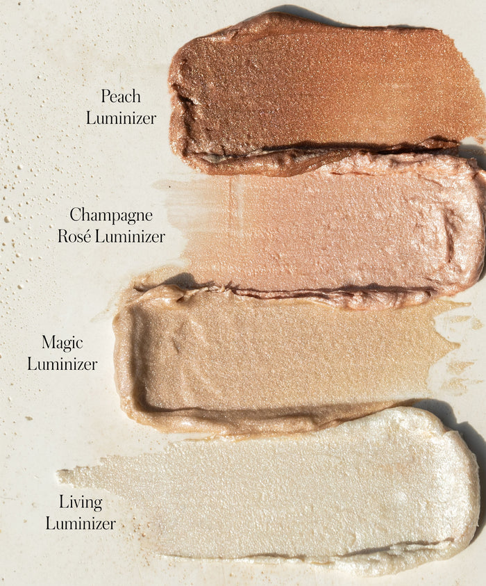 Four shimmering shades of Luminizer makeup swatched on a light background, including Peach, Champagne Rosé, Magic, and Living, showcasing natural highlighting colors.