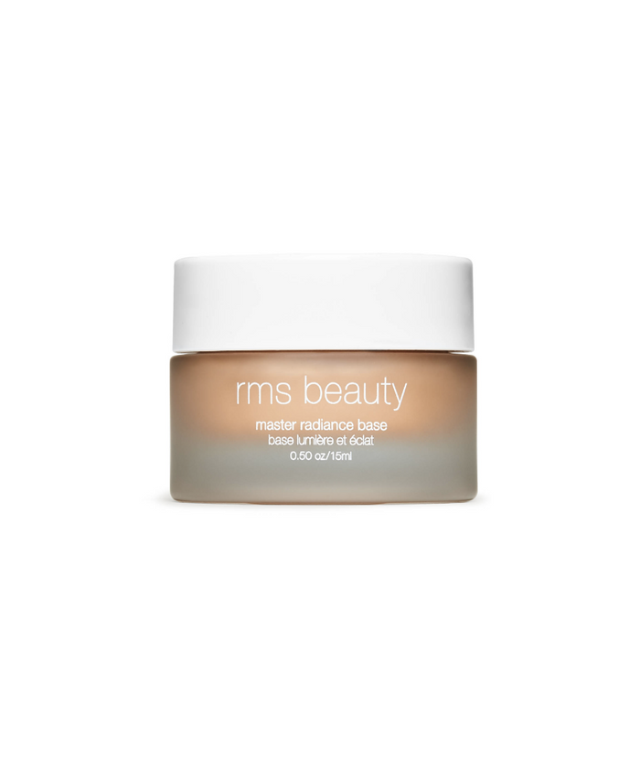 Jar of Master Radiance Base by RMS Beauty in a frosted glass container with a white lid, showcasing a natural tone makeup base designed for clean beauty and skincare infused makeup.