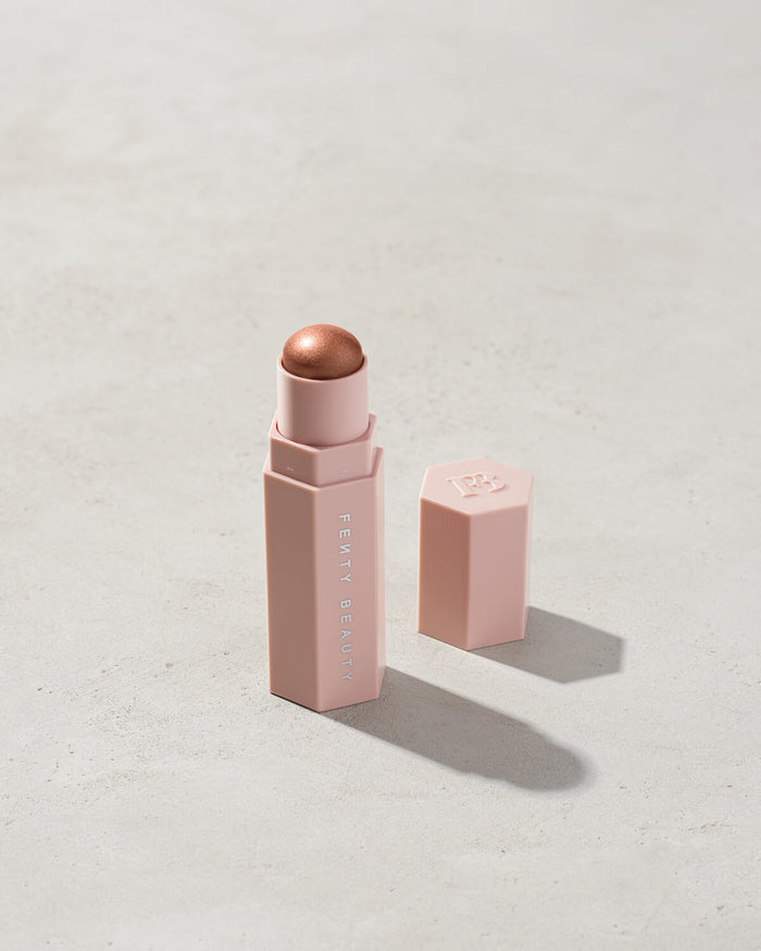 Match Stix Shimmer Skinstick shown in shade Sinamon on a concrete background.