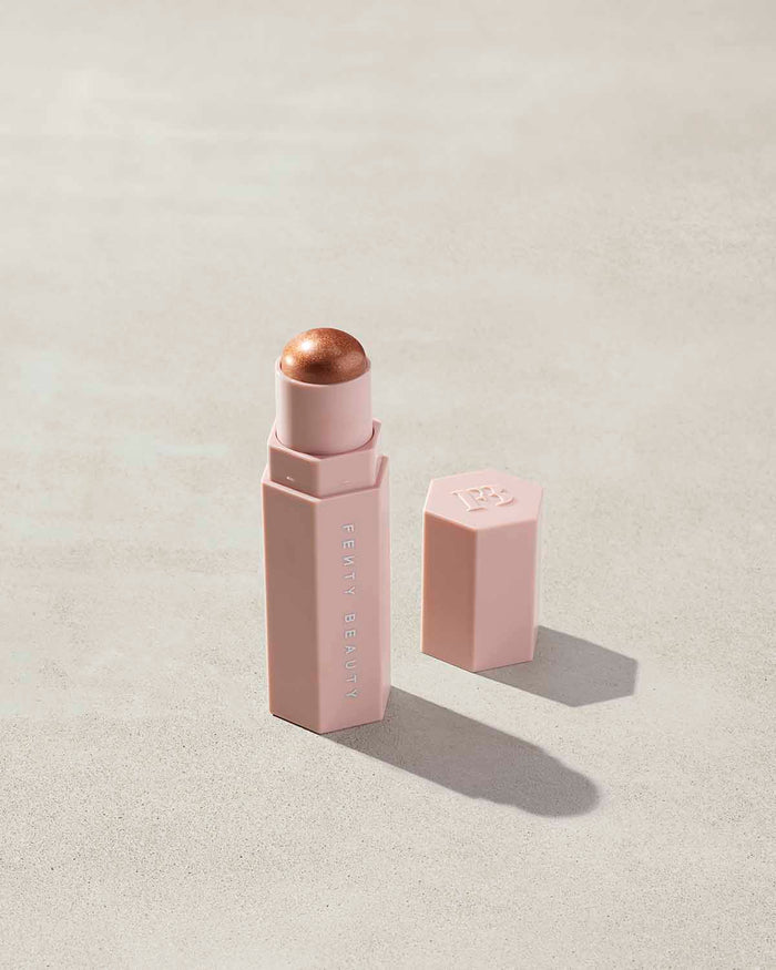 Match Stix Shimmer Skinstick shown in shade Truffle Spark on a concrete background.