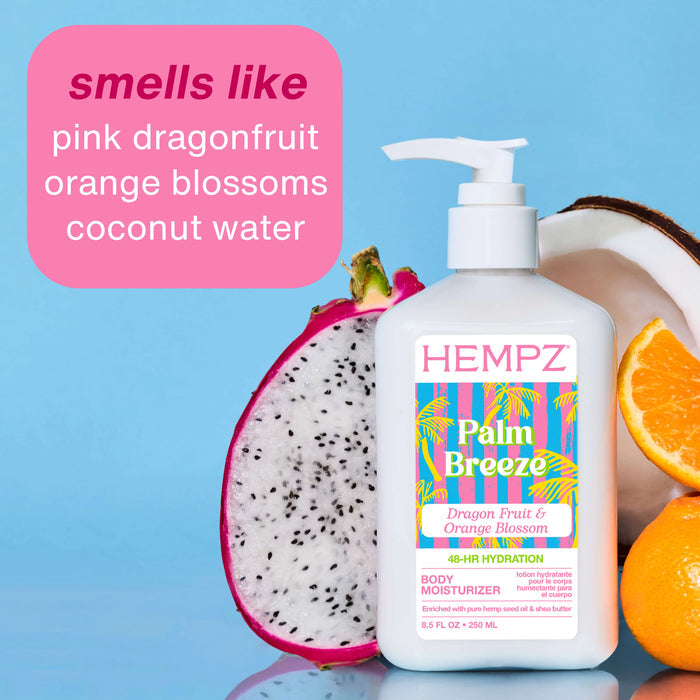 Hempz Palm Breeze body moisturizer with dragon fruit, orange, and coconut on a blue background