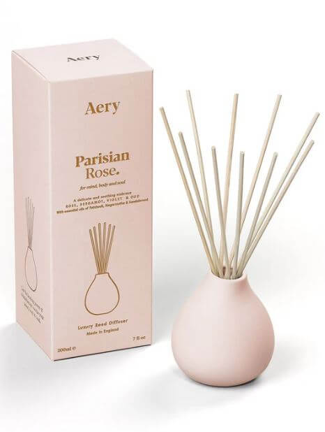 Parisian Rose reed diffuser with elegant packaging, featuring minimalist design and aromatic rose scent.