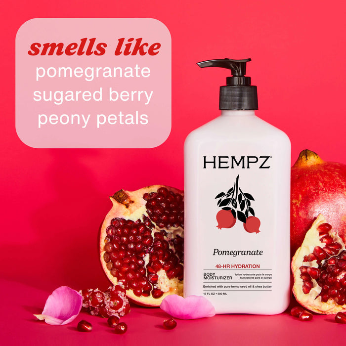 Hempz Pomegranate body moisturizer with pomegranate and pink flower on a red background