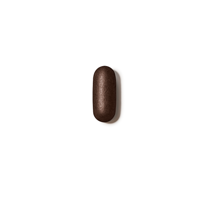 Brown pill on a white background