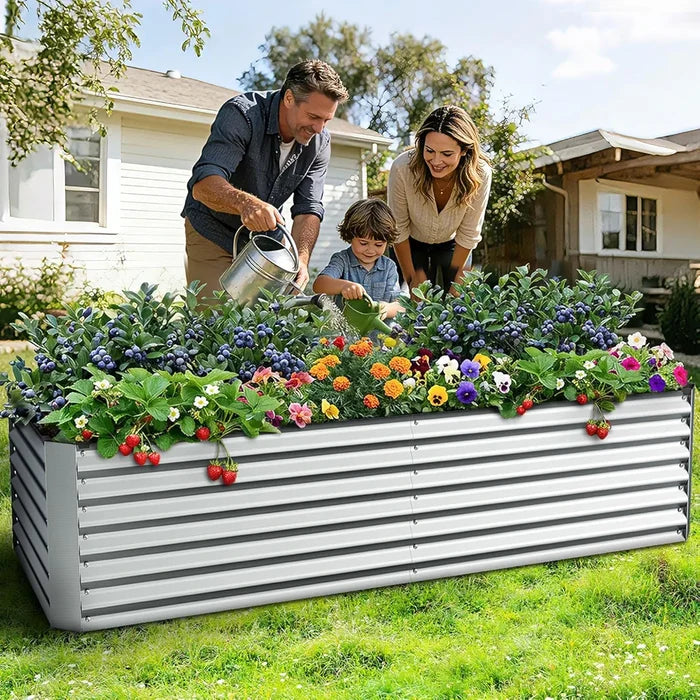 Family gardening together with a raised garden bed in a backyard.