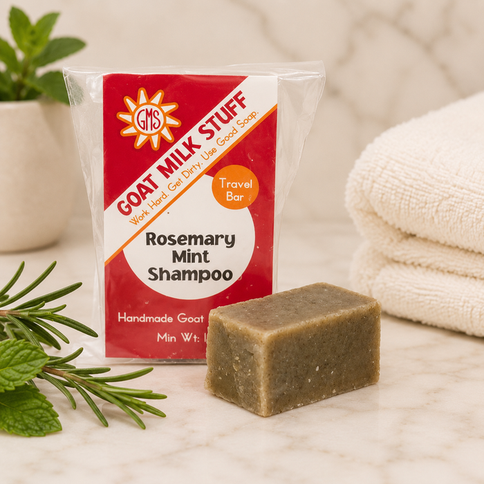 Goat Milk Stuff Rosemary Mint Shampoo bar with packaging on a neutral background