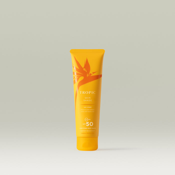Tropic Skin Shade sun cream 100ml SPF 50. Yellow tube with orange leaf design. It's certified reef safe and water resistant.