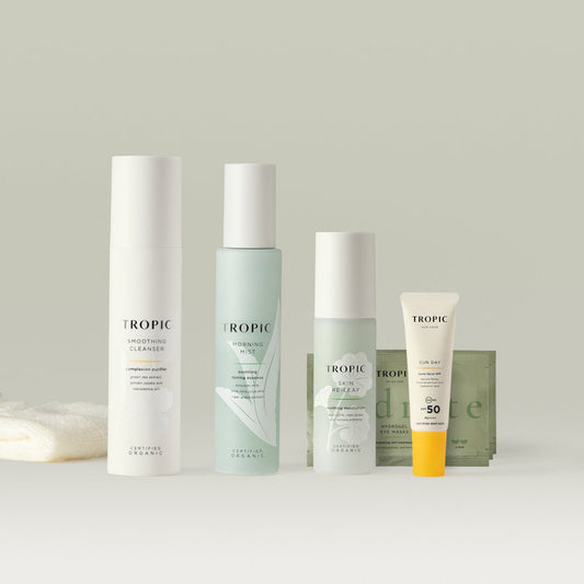 A Tropic skincare set featuring cleanser, mist, moisturiser, eye masks, and SPF.
